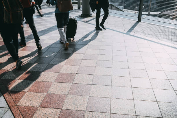 istock people walking in the street, (blur focus) 825046916
