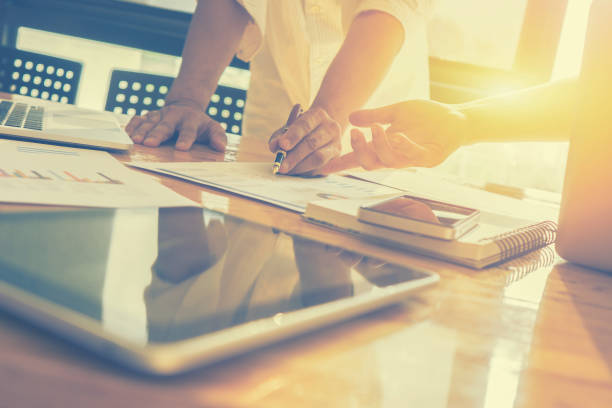 istock Team work concept,team meeting,man and woman working in the office. collaborative teamwork. Project managers meeting.business crew working with new startup. Analyze plans.selective focus,vintage color 825049392