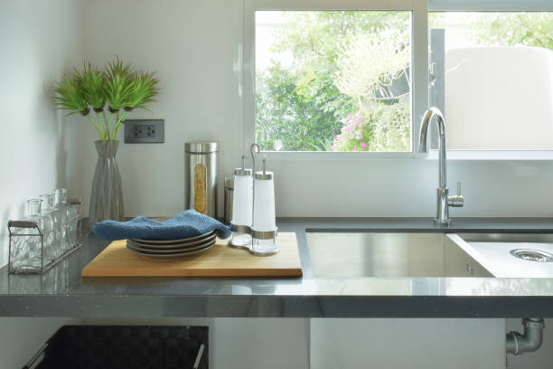 istock Dishes next to sink in the kitchen 825049690