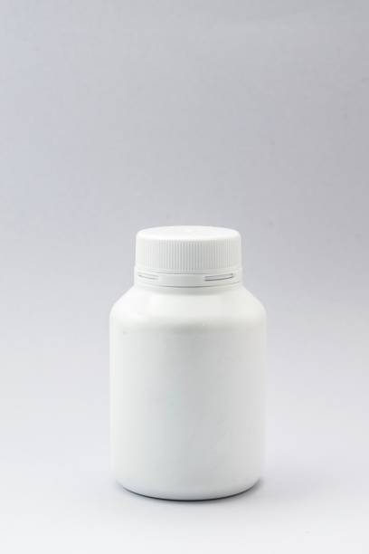 istock plastic bottle white and drug on the white background. Using wallpaper for package work photo and isolated image. 825055926