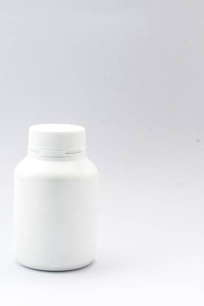 istock plastic bottle white and drug on the white background. Using wallpaper for package work photo and isolated image. 825055938