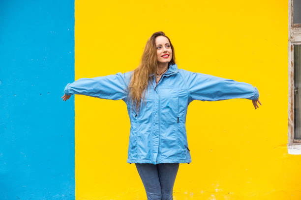 istock Young woman enjoying rainy day 825058624
