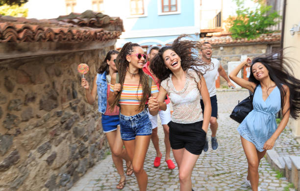 istock Cheerful friends walking on street 825058688