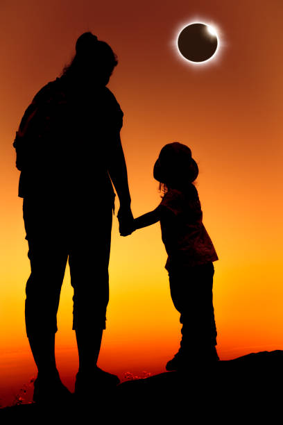 istock Amazing scientific natural phenomenon. Total solar eclipse glowing on sky. 825058800