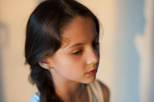 istock attractive young girl with a pigtail 825059284