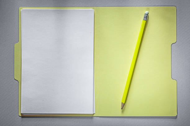 istock Opened office folder paper pencil on grey background education c 825059912