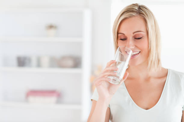 istock Gorgeous woman drinking water 825063740