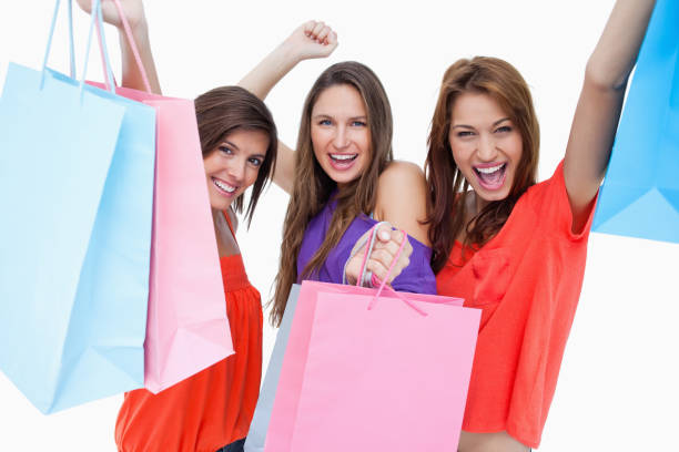 istock Young women elevating their purchase bags 825064410