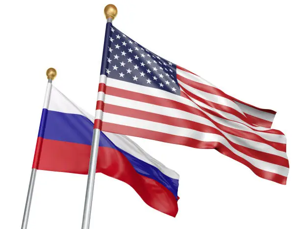 National flags from the United States and Russia flying side by side to represent relations between the two countries, isolated on a white background.