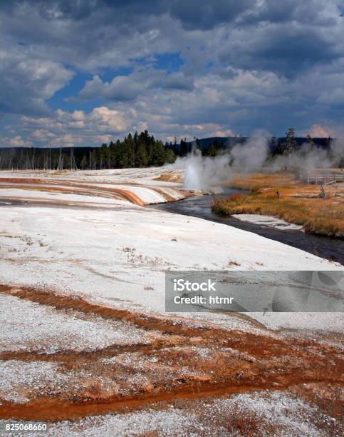 Iron Spring Creek Flowing Past Cliff Geyser In Black Sand Geyser Basin In Yellowstone National Park In Wyoming Usa Stock Photo - Download Image Now