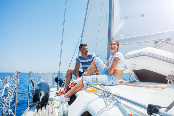istock Father with adorable daughter resting on yacht 825071256