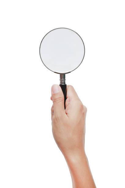 istock Hand holding Magnifying glass isolated on white. 825074370