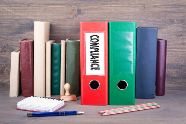 istock Compliance. Binder on desk in the office. Business background 825074424