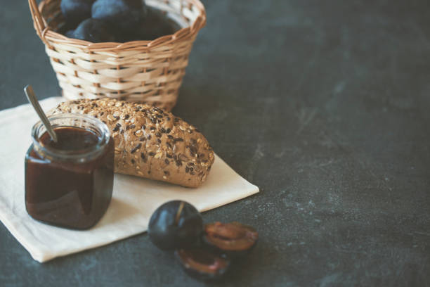 Plum jam, integral bread and fresh plums