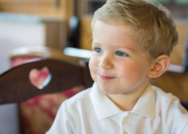 istock Happy infant boy at restaurant 825075928
