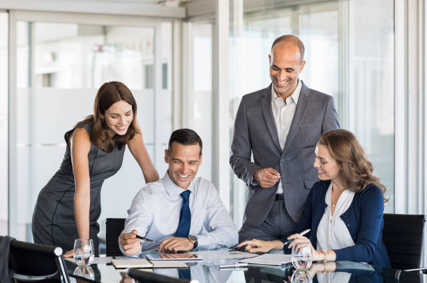 istock Businesspeople in meeting room 825082700