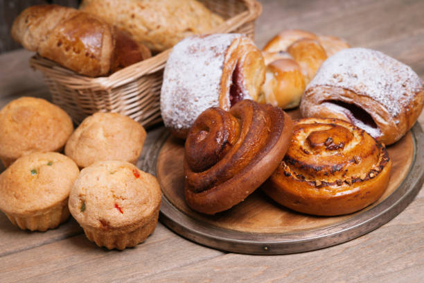 istock Fresh baked homemade buns, cupcakes and rolls 825082802