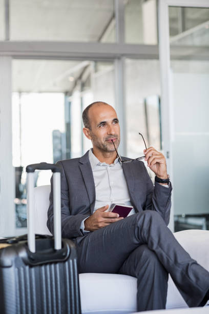 istock Businessman thinking at airport 825083192