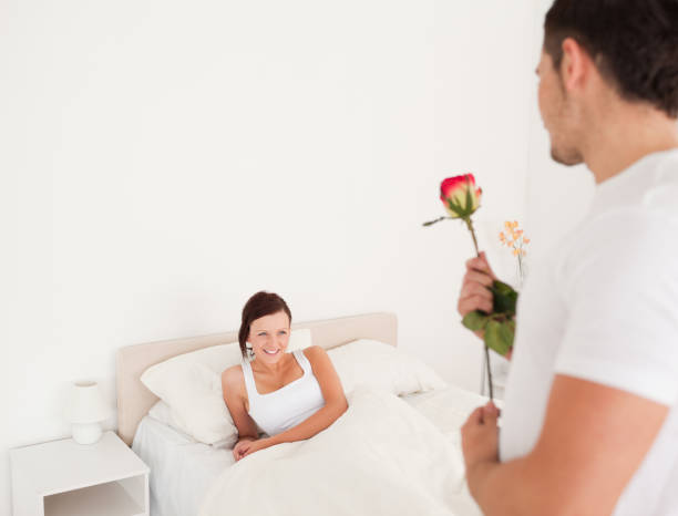 istock Handsome guy with a rose for his girlfriend 825087558