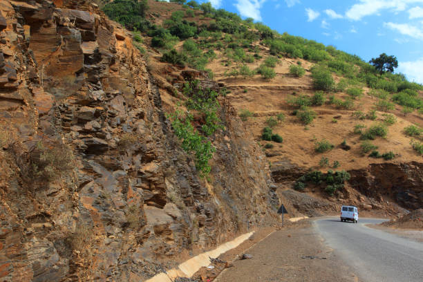 istock curvy mountain road, Asphalt road in summer forest, morocco lanscape. 825091050