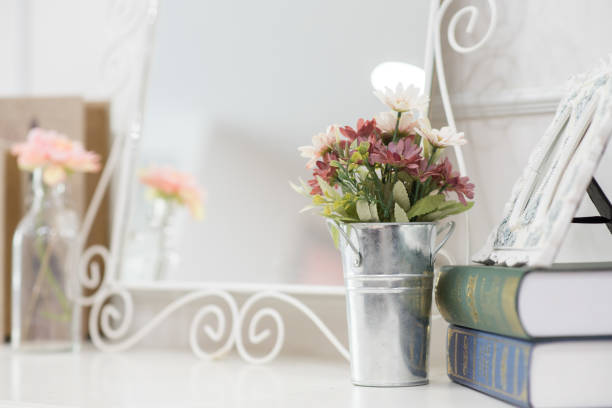 istock Selective focus on Small Artificial Plant in a pot decorate object at dressing table with mirror 825095198