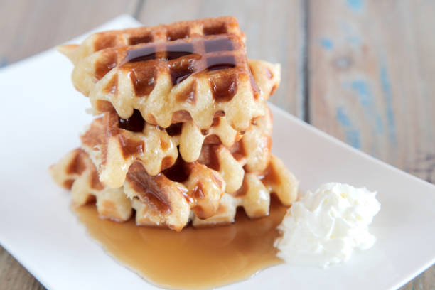 istock Maple syrup waffle with whipped vanilla ice cream 825095246