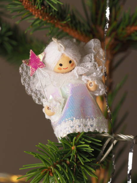 istock Hand crafted traditional Christmas tree decoration Angel hanging on  a tree branch, Melbourne 2016 825095792
