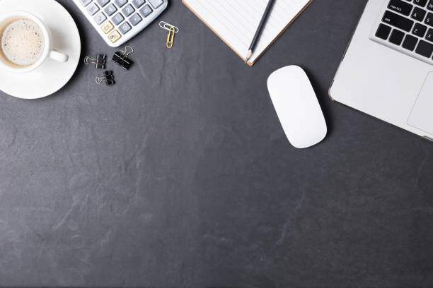 istock Office black desk table with calculator, paper note, supplies 825095812