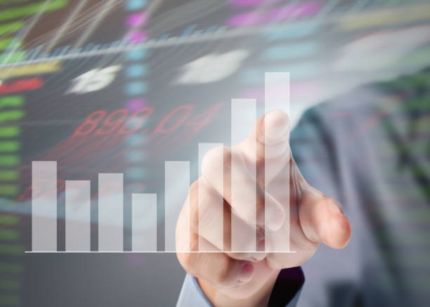 istock businessman with financial symbols coming from hand 825097048