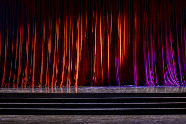 istock Red curtains and wooden stage. 825106726