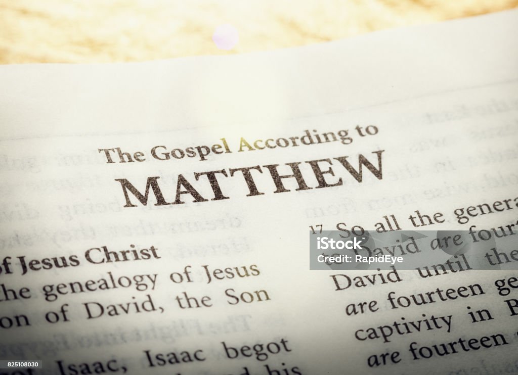 The Gospel according to Matthew in the Holy Bible A copy of the Bible is open to the title page of ther first book of the New Testament, the Gospel according to Matthew. Gospel Stock Photo