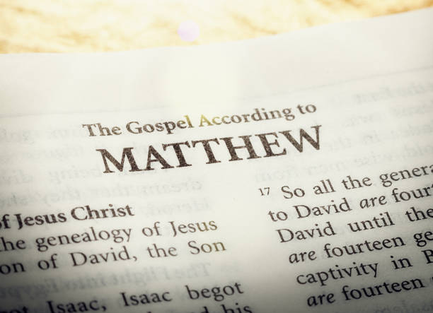 The Gospel according to Matthew in the Holy Bible A copy of the Bible is open to the title page of ther first book of the New Testament, the Gospel according to Matthew. gospel stock pictures, royalty-free photos & images