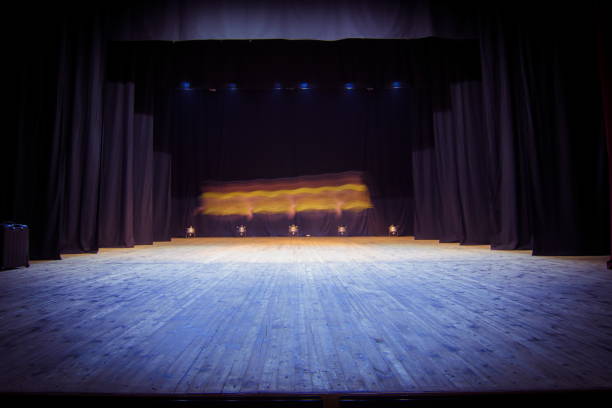 istock An empty stage of the theater, lit by spotlights 825108750