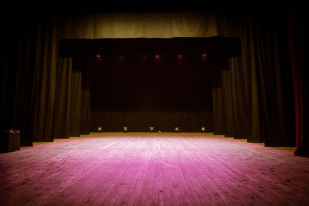 istock An empty stage of the theater, lit by spotlights 825109776