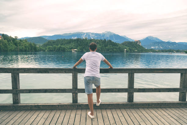 istock Handsome man enjoying the view on the lake. 825112136