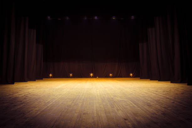 istock An empty stage of the theater, lit by spotlights 825112808