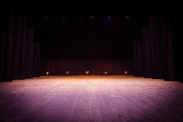 istock An empty stage of the theater, lit by spotlights 825112848