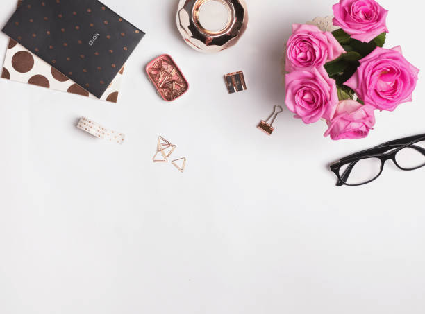 istock Stylish rose gold accessories, glasses and roses 825113012