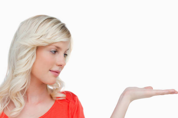 istock Beautiful woman placing her hand palm up 825113044