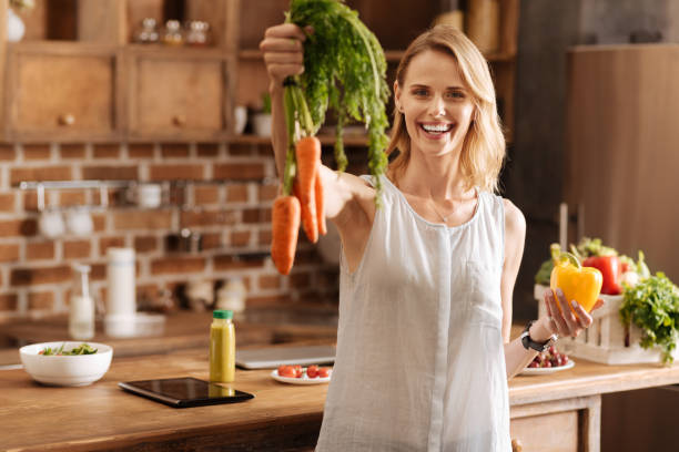 istock Lively gorgeous lady enthusiastic about her vegetarian diet 825113144