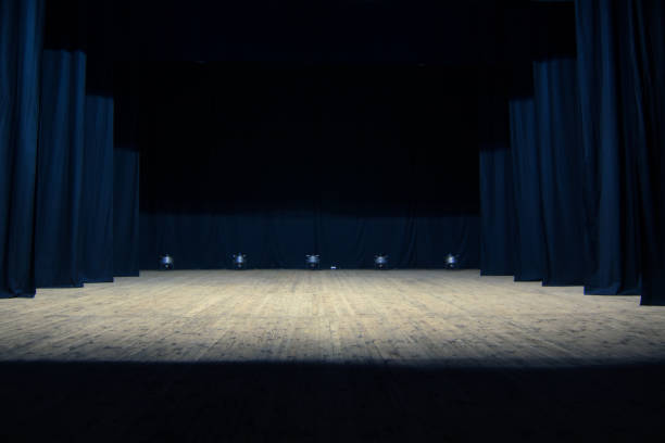istock An empty stage of the theater, lit by spotlights 825113184