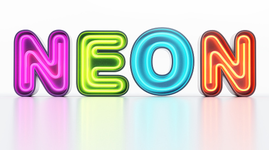 Multi-colored neon letters on white shiny background.