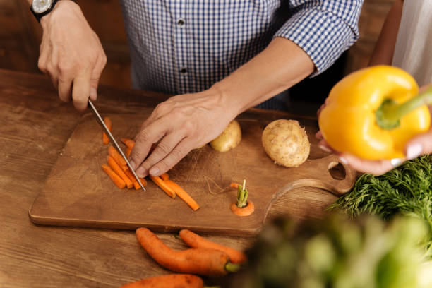 istock Neat wonderful guy making a meal at home 825116164