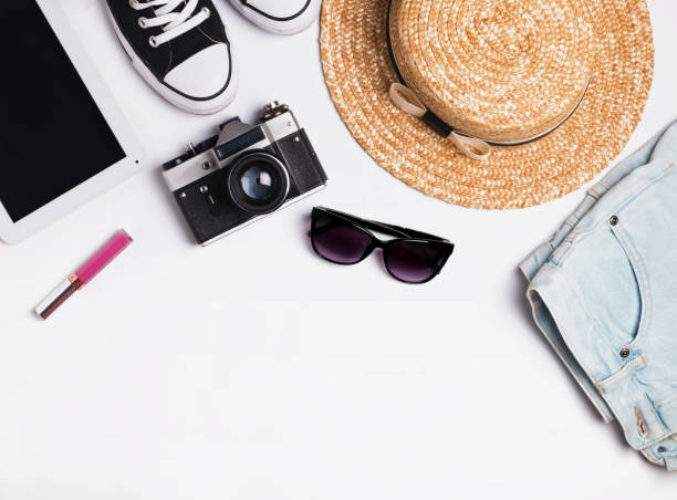istock Hat, sneakers, jeans and vintage camera, top view 825117838