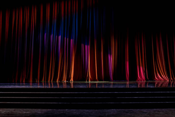 istock Red curtains and wooden stage. 825121282