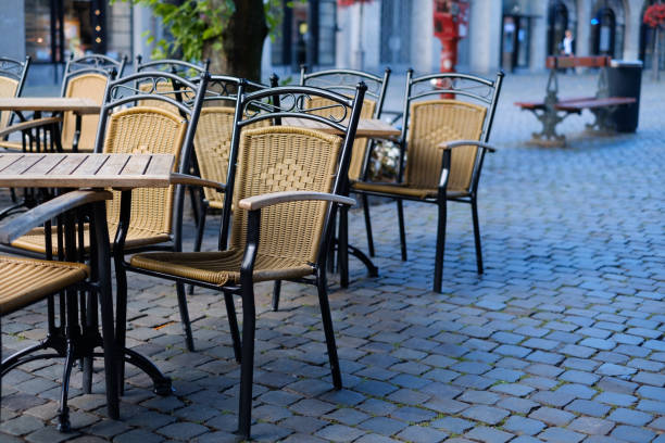 istock Cafe chairs outside in a street 825124764