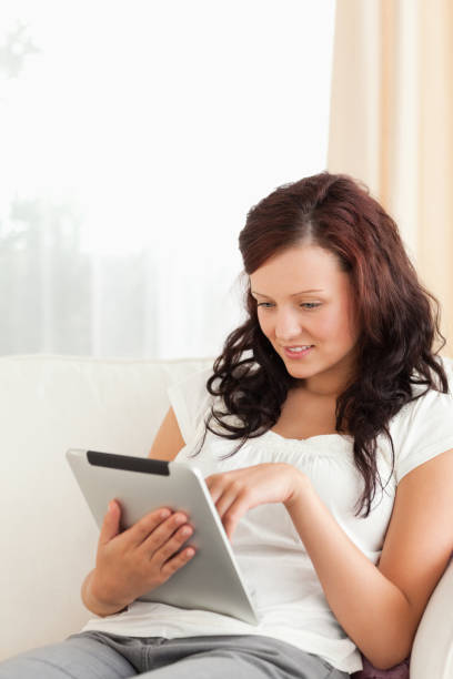 istock Woman holding a tablet 825124822