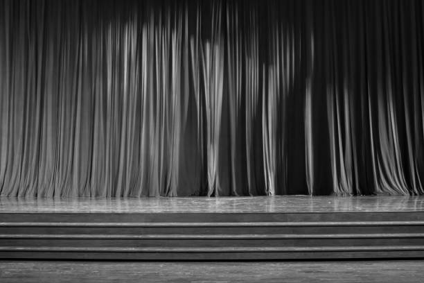 istock Black and white curtains and wooden stage. 825124902