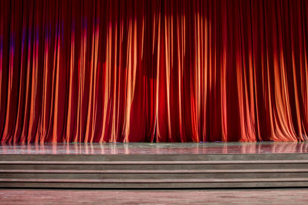 istock Red curtains and wooden stage. 825125610