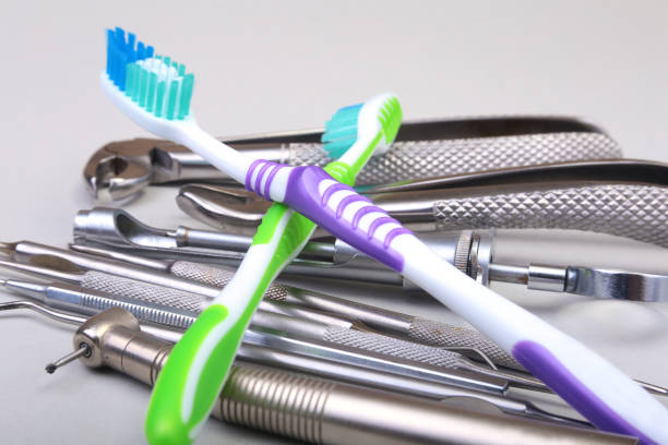istock dental care toothbrush with dentist tools isolated on white background. Selective focus. 825128584